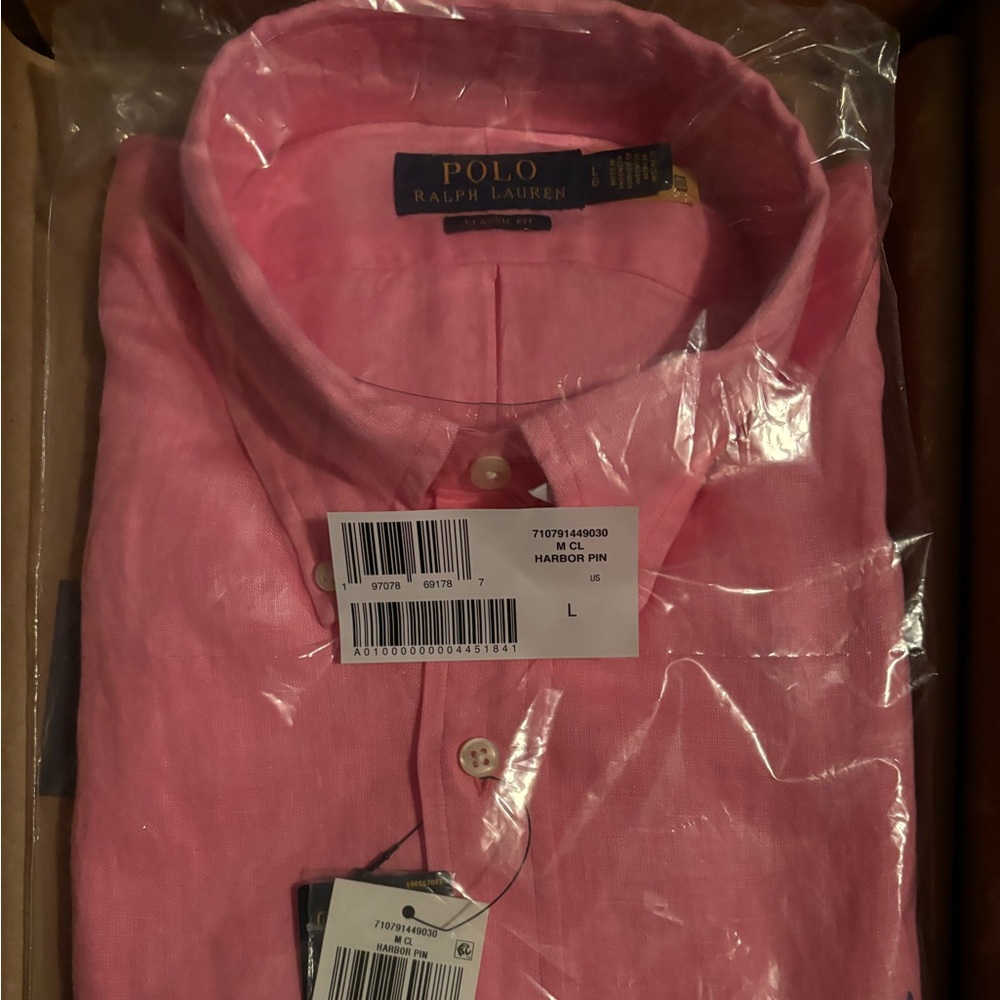 pink men’s polo. Never worn still in the plastic and original box it came in. - Picture 2 of 5